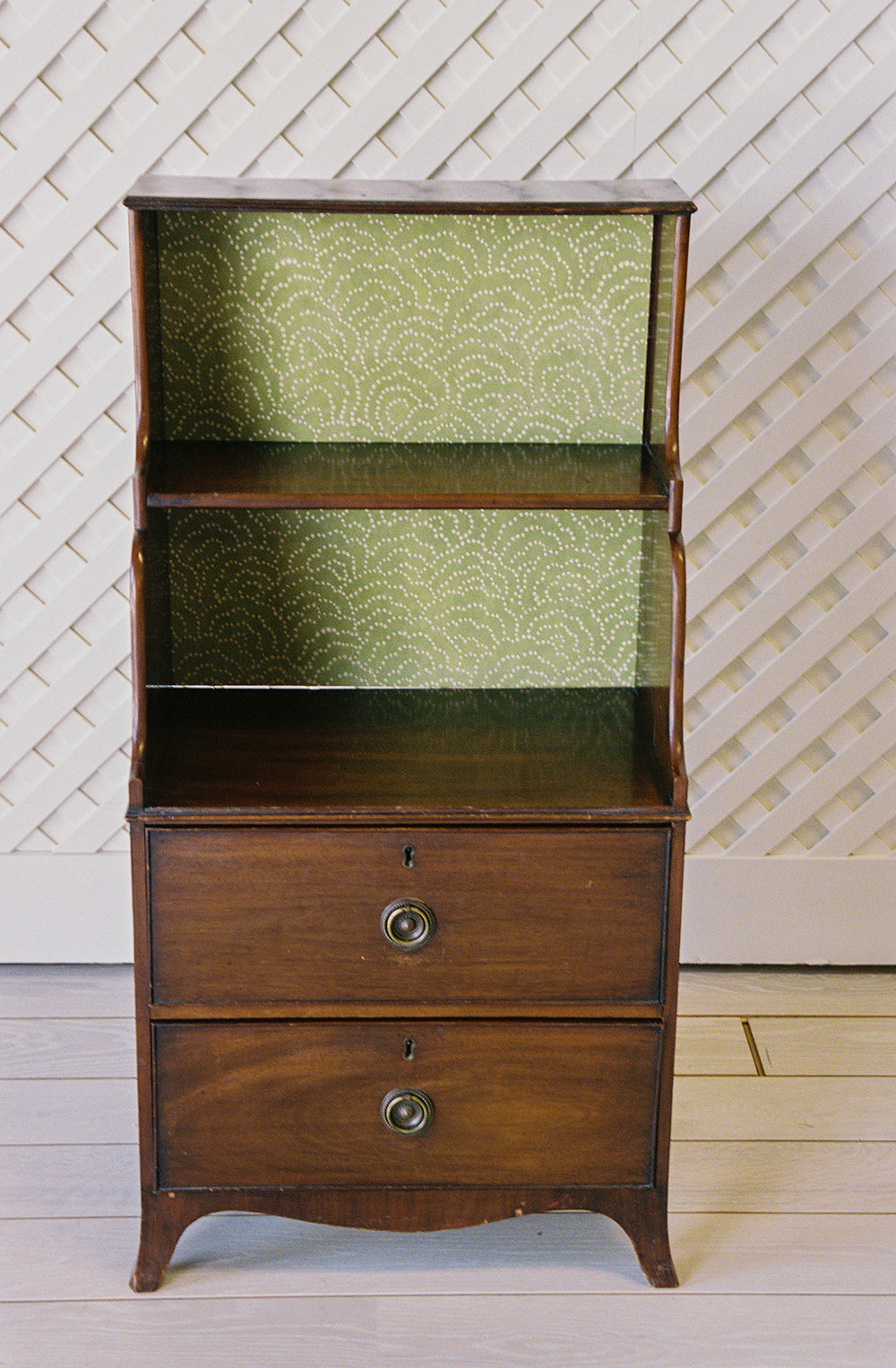 Georgian style mahogany waterfall bookcase with graduated shelves and two drawers