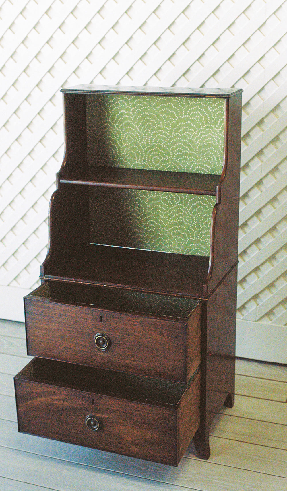 Georgian style mahogany waterfall bookcase with graduated shelves and two drawers, from the side, drawers open