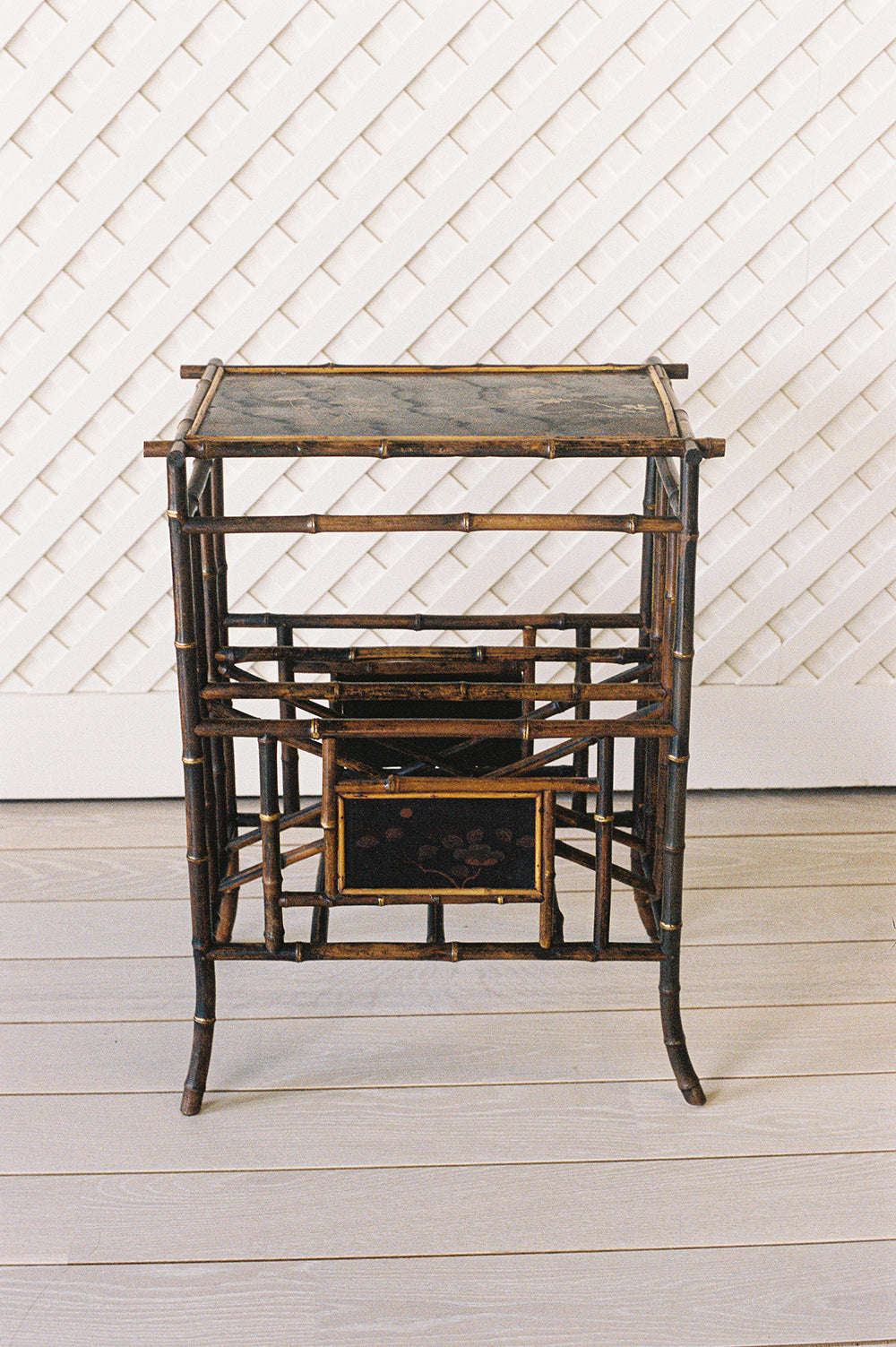 Victorian bamboo lacquer side table with a hand painted top and a woven cane shelf