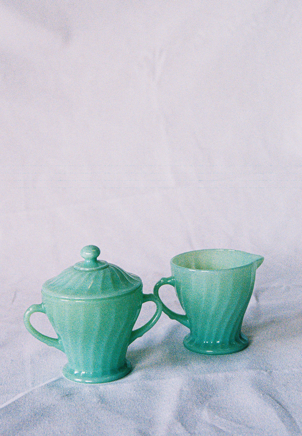 Jadeite glass creamer and lidded sugar bowl, upright