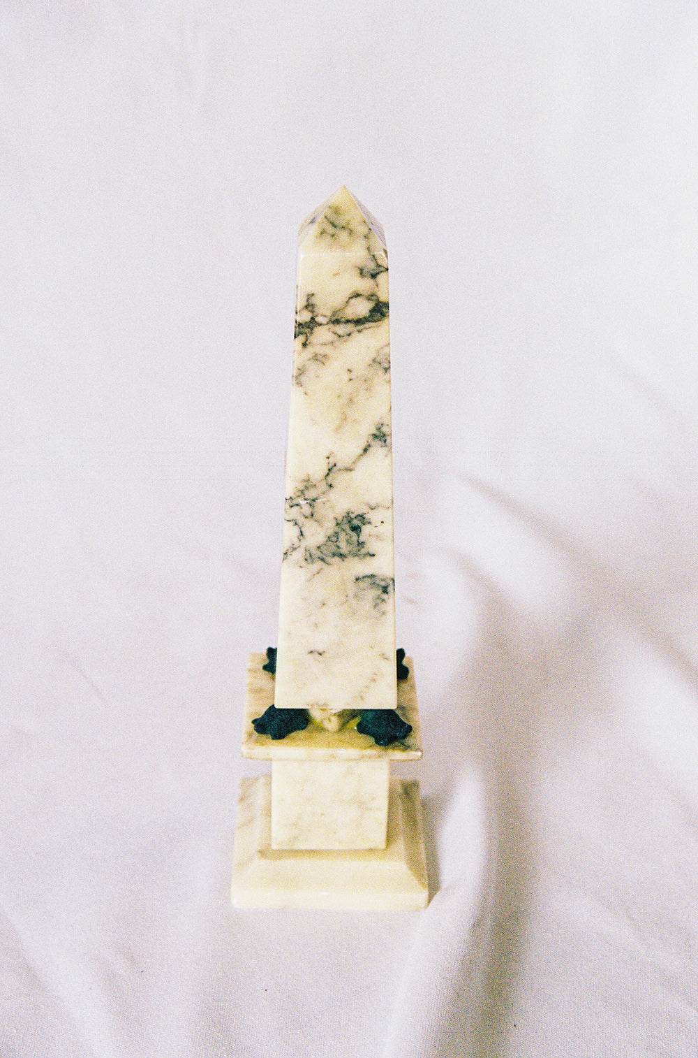 Alabaster obelisk with a turtle at each corner of its base