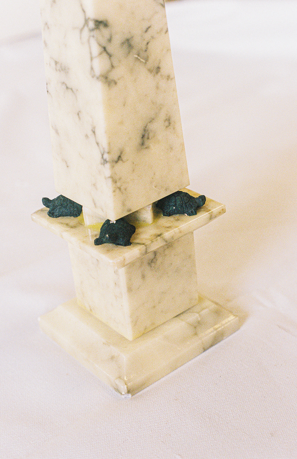 Alabaster obelisk with a turtle at each corner of its base