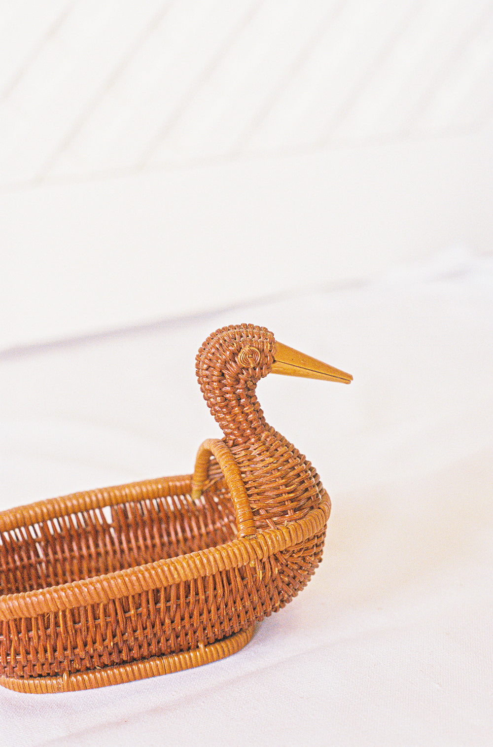 Wicker duck trinket basket, from the side