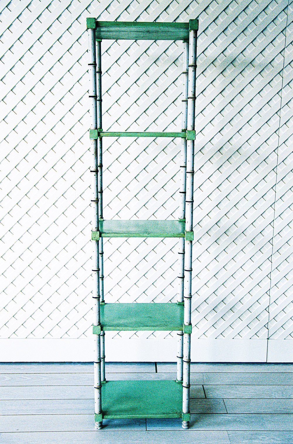 Faux bamboo etagere with green glazed shelves