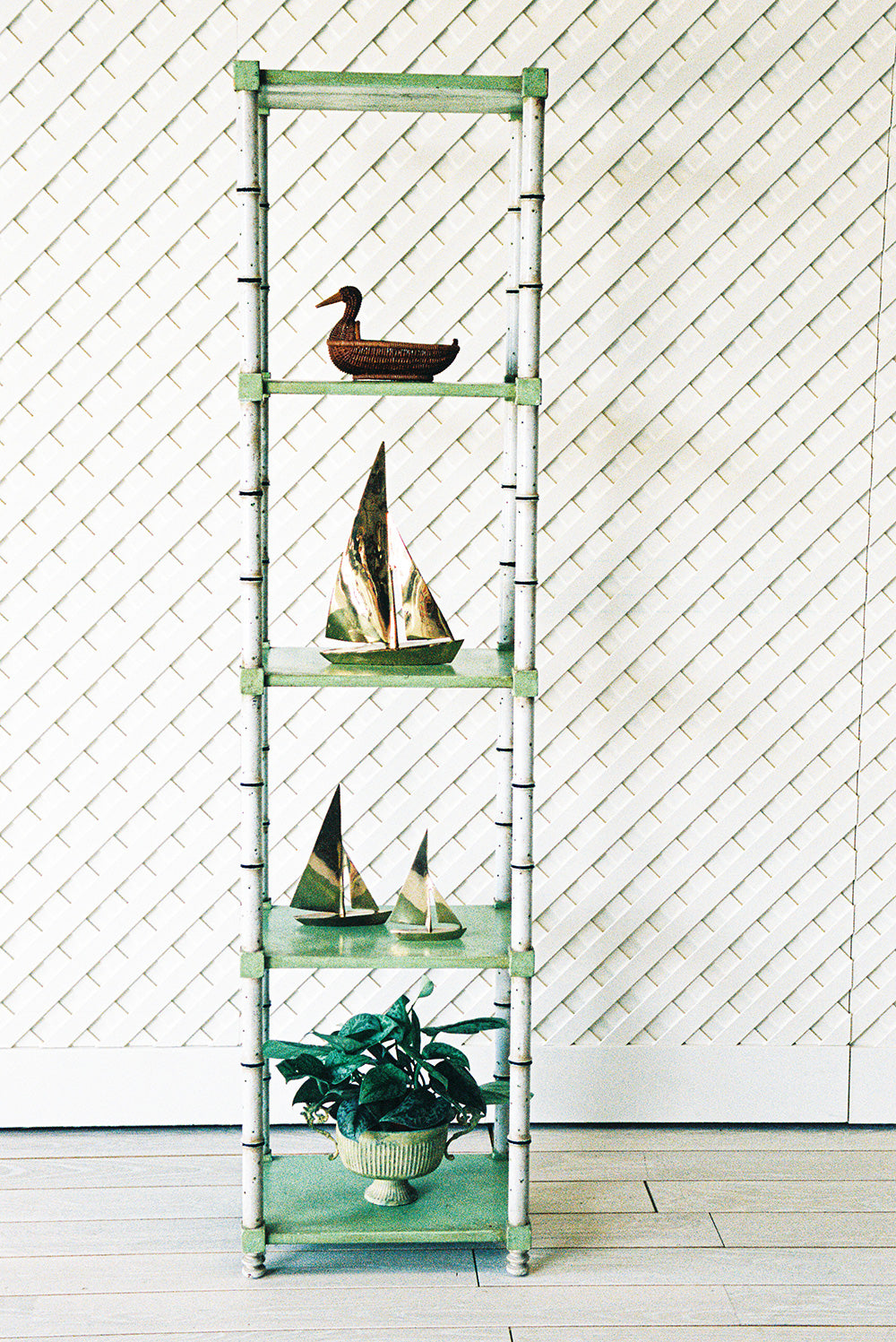 Faux bamboo etagere with green glazed shelves