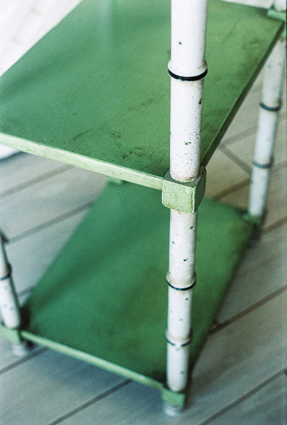 Faux bamboo etagere with green glazed shelves, close view