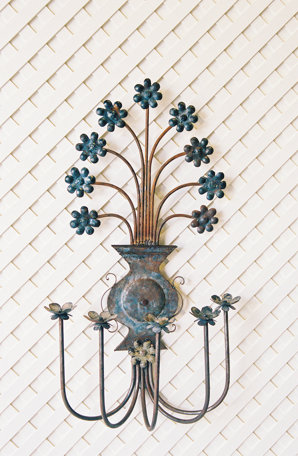 Pair of vintage floral metal candle sconces with a verdigris patina