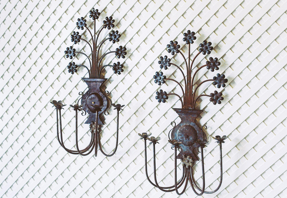Pair of vintage floral metal candle sconces with a verdigris patina