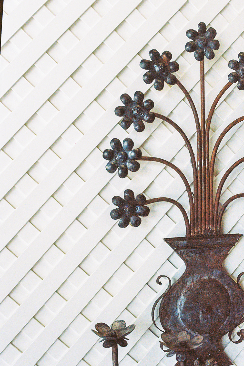 Pair of vintage floral metal candle sconces with a verdigris patina