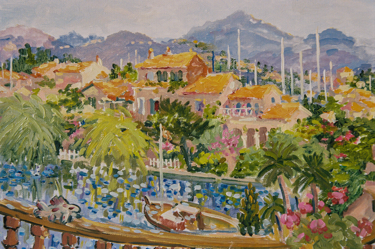 Georges Flanet oil painting of a hillside village with tiled roofs, palms and a harbor of sailboats beneath blue mountains
