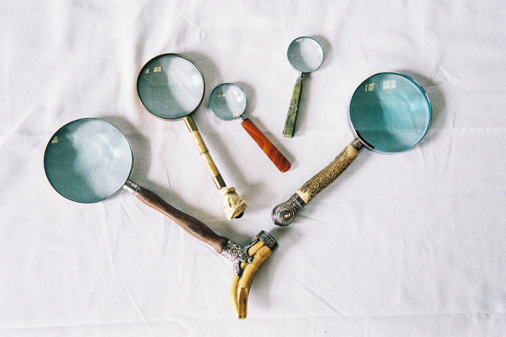 Five magnifying glasses with carved bone, hardwood and decorative metal handles