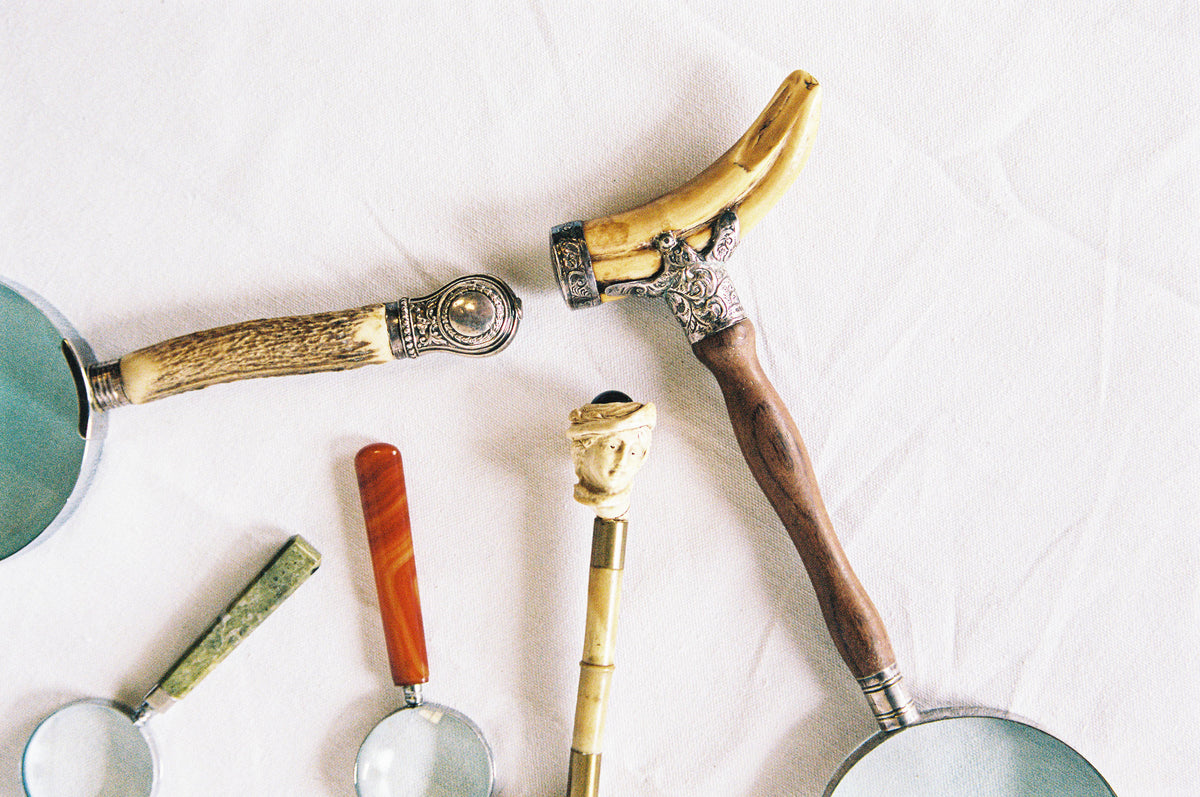 Five magnifying glasses with carved bone, hardwood and decorative metal handles