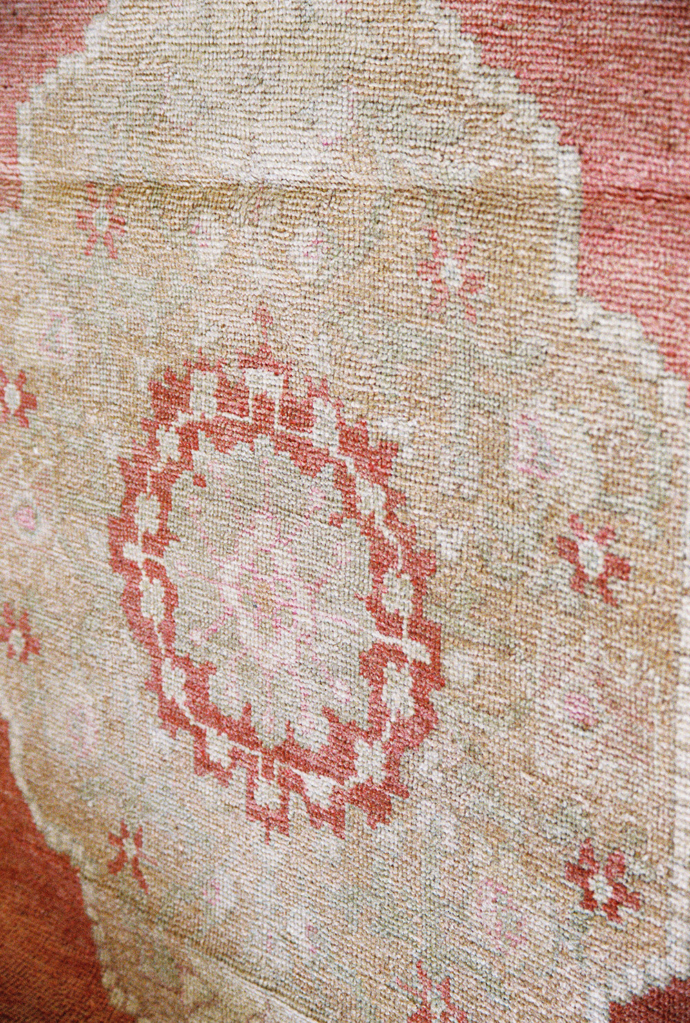 Oushak wool runner with three medallions in pink, tan and cream, close view