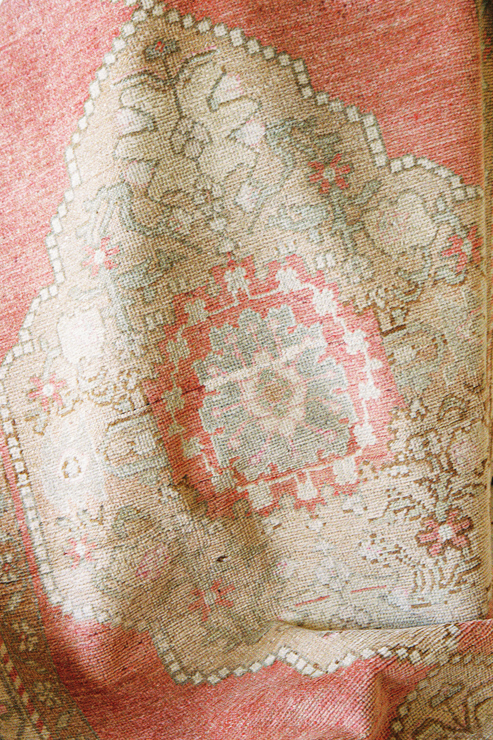 Oushak wool runner with three medallions in pink, tan and cream, close view