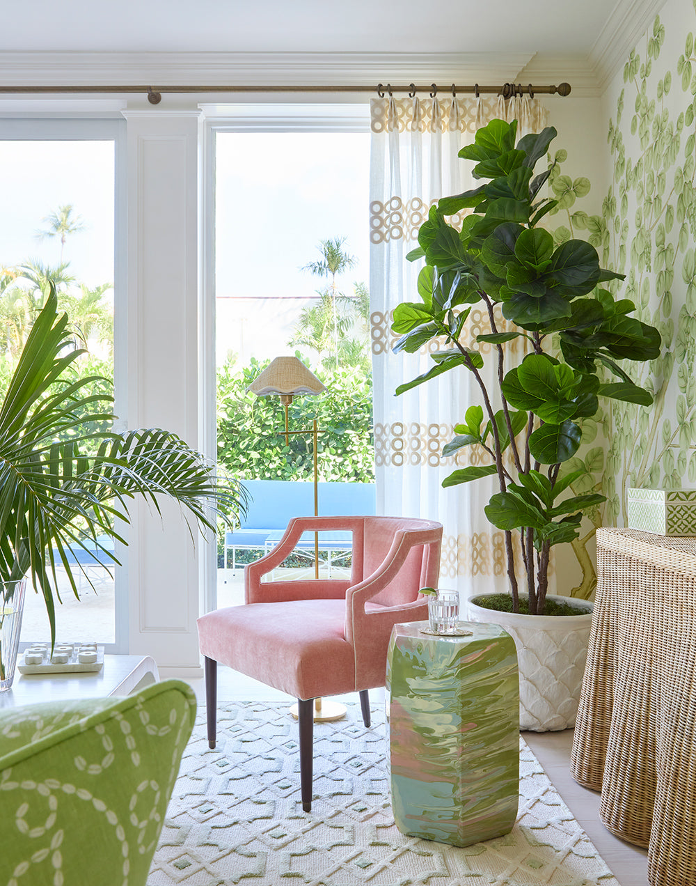 Corner by the terrace doors with a pink armchair, a fiddle leaf fig and a celadon garden stool on a patterned rug